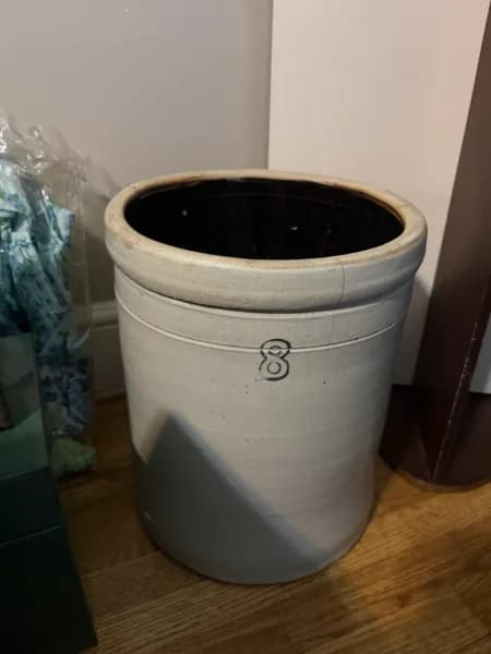 Ceramic floor planter urn with dark interior and maker mark