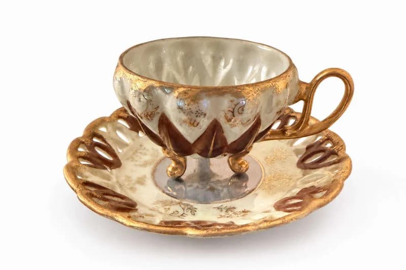 Footed lusterware demitasse cup and saucer set