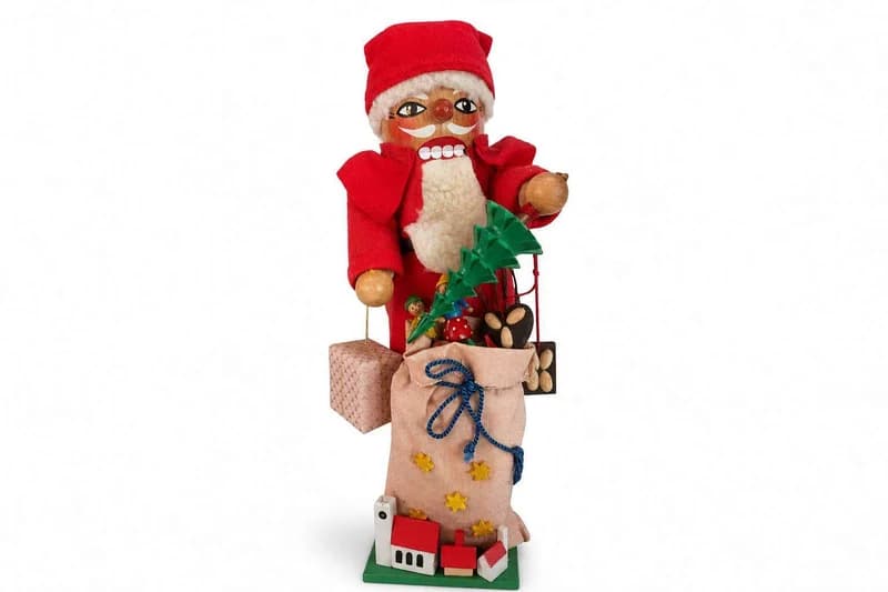 Handmade-style Santa Claus Christmas figurine with burlap sack and toys